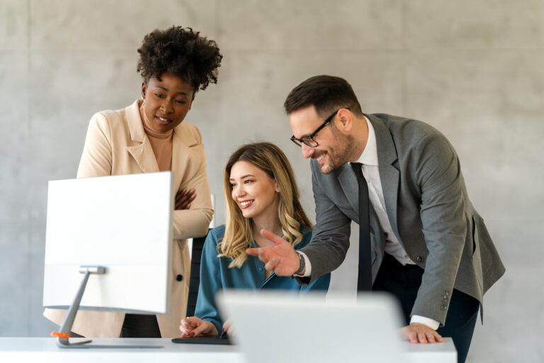 Group of diverse multiethnic business people and software developers working as a team in office.